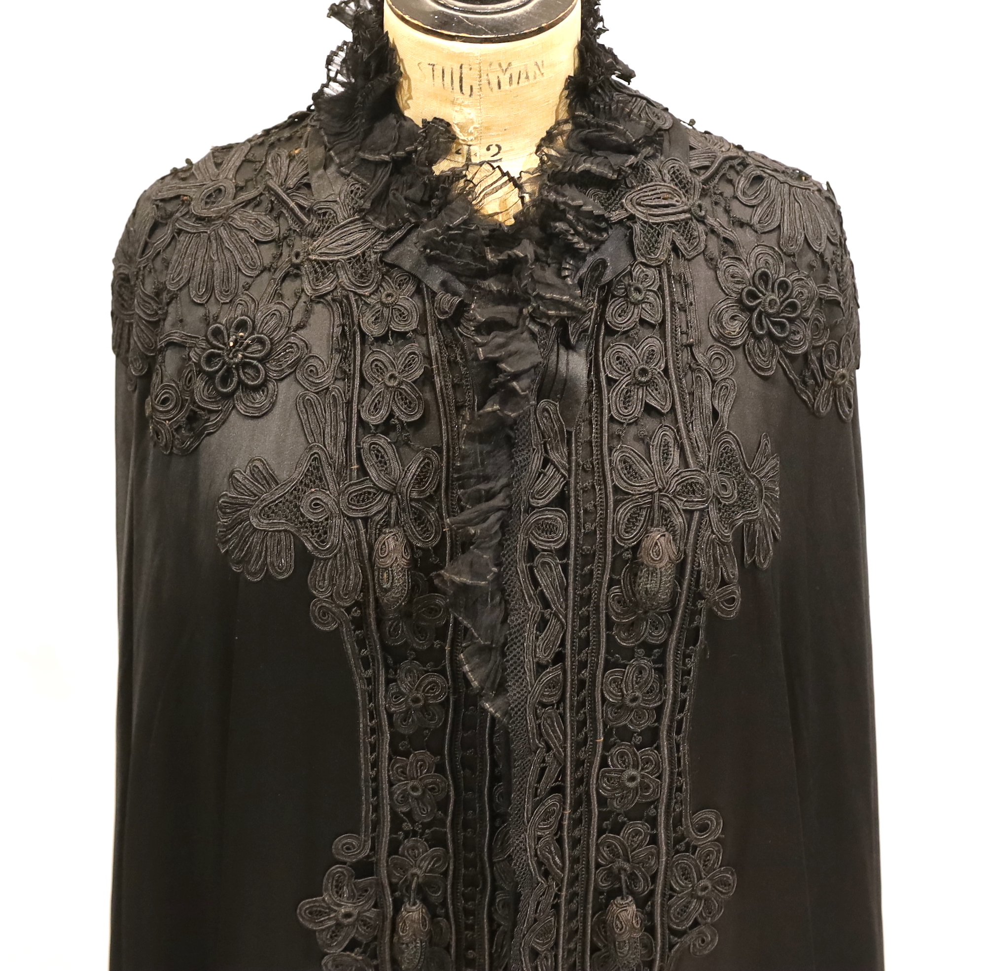 A Victorian black silk and tape lace opera cape, with black pleated chiffon collar
